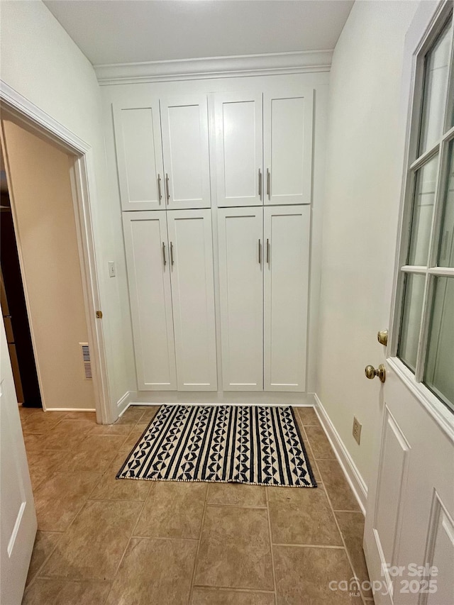 7067 Rocky Falls Rd, Charlotte, NC 28211 - mudroom featuring baseboards