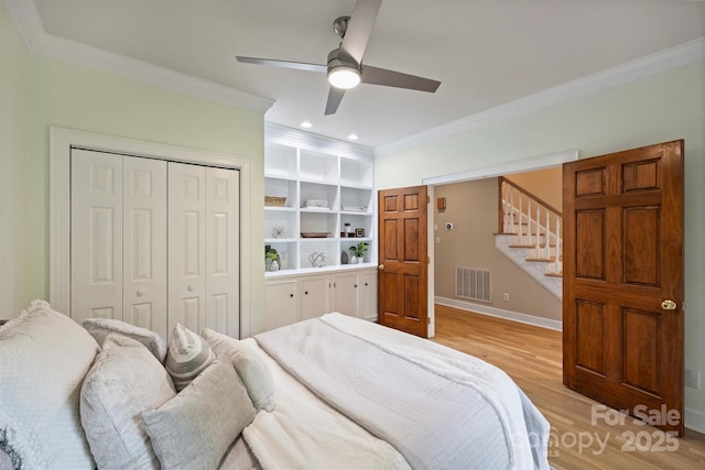 7067 Rocky Falls Rd, Charlotte, NC 28211 - bedroom featuring crown molding, light wood finished floors, a closet, baseboards, and a ceiling fan