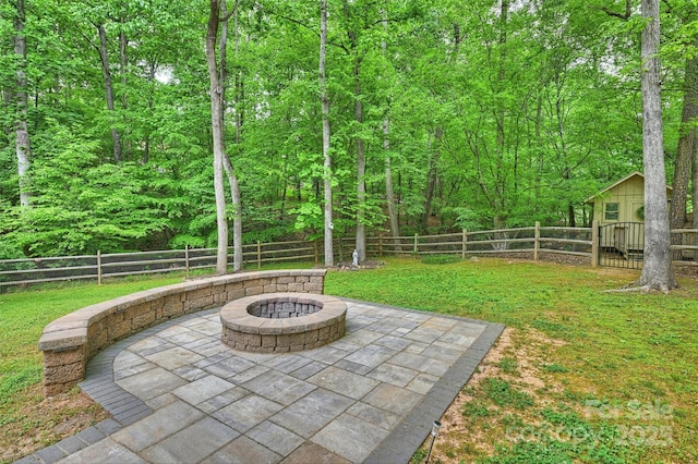 7067 Rocky Falls Rd, Charlotte, NC 28211 - view of yard featuring an outdoor fire pit, a patio area, and a forest view
