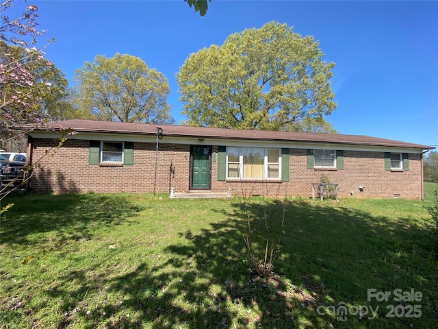 single story home featuring a front yard, crawl space, and brick siding