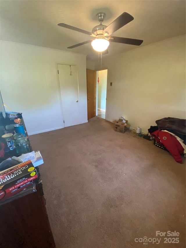 unfurnished bedroom with carpet and ceiling fan