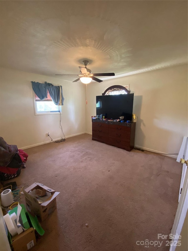 unfurnished bedroom featuring ceiling fan, carpet floors, and baseboards