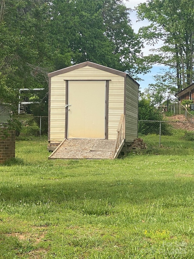 view of shed with fence
