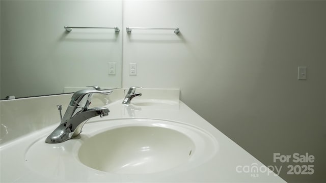 bathroom with double vanity and a sink