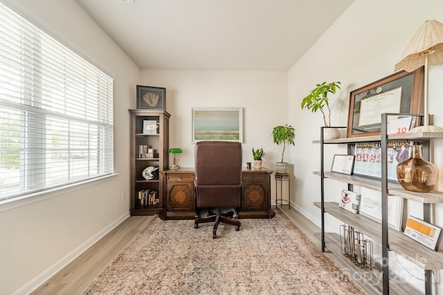 office featuring baseboards and wood finished floors