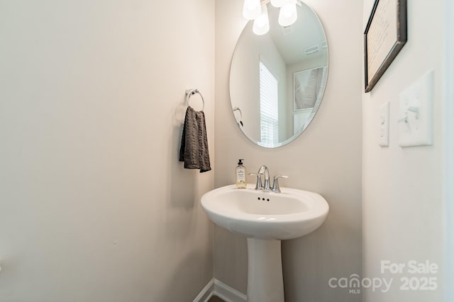 bathroom featuring baseboards