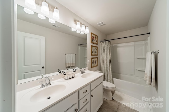 bathroom with visible vents, tile patterned flooring, and a sink