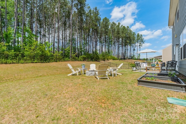 view of yard with a garden and fence