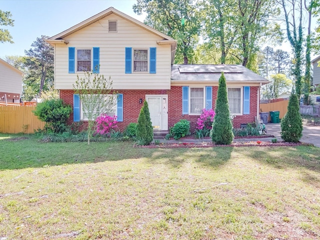 6820 Elm Forest Dr, Charlotte, NC 28212 - split level home featuring a front yard, brick siding, and fence