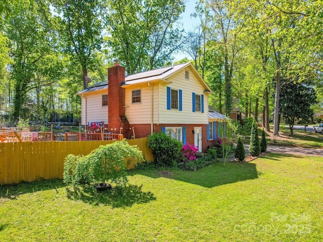 6820 Elm Forest Dr, Charlotte, NC 28212 - rear view of house featuring brick siding, fence, a lawn, and a chimney