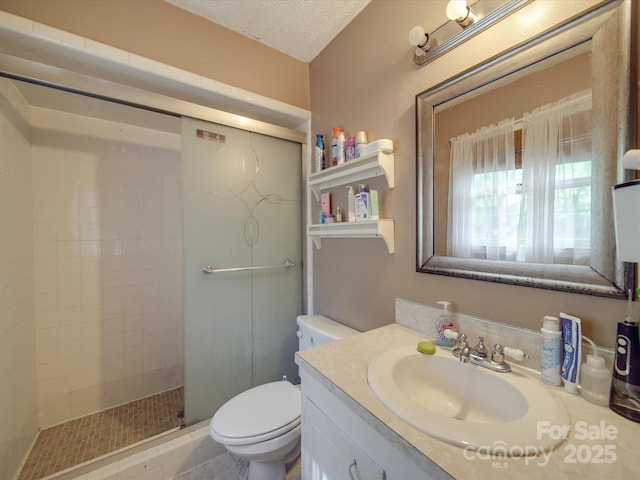 6820 Elm Forest Dr, Charlotte, NC 28212 - bathroom with a shower stall, vanity, a textured ceiling, and toilet