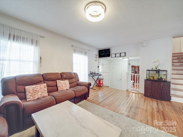 6820 Elm Forest Dr, Charlotte, NC 28212 - living room featuring stairway, wood finished floors, and a textured ceiling