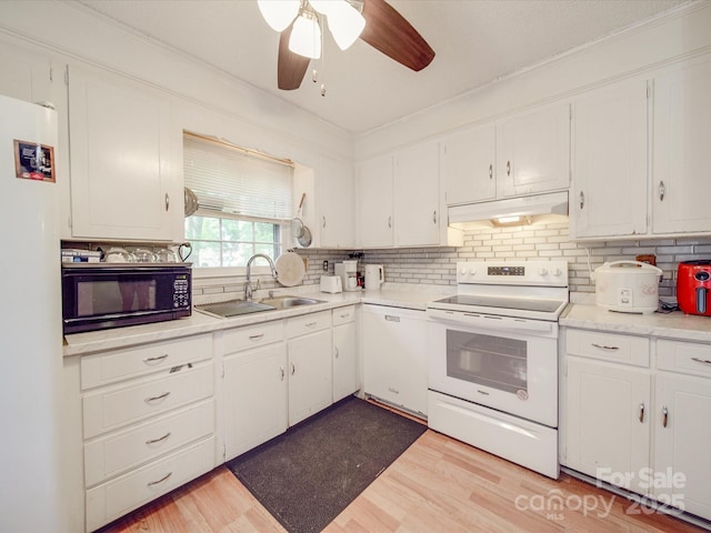6820 Elm Forest Dr, Charlotte, NC 28212 - kitchen with a sink, white cabinets, white appliances, and under cabinet range hood