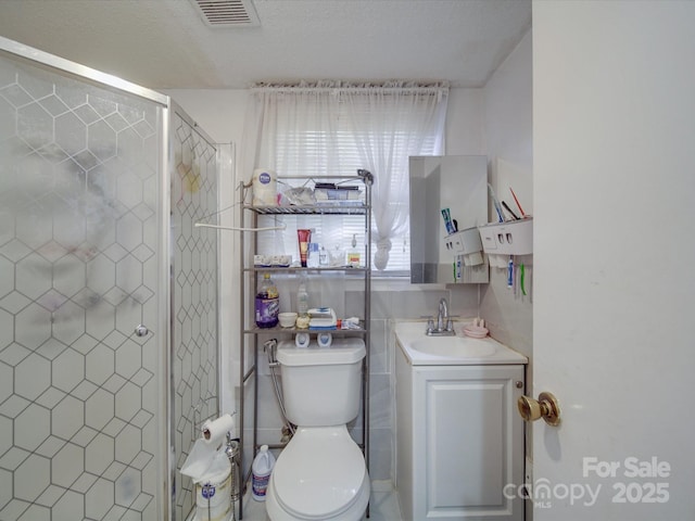 6820 Elm Forest Dr, Charlotte, NC 28212 - bathroom featuring visible vents, toilet, a stall shower, and vanity