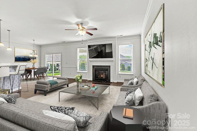 1617 Post Ct, Gastonia, NC 28054 - living room with wood finished floors, ceiling fan, ornamental molding, and a healthy amount of sunlight