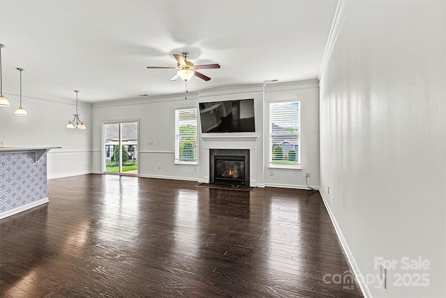 1617 Post Ct, Gastonia, NC 28054 - unfurnished living room featuring ceiling fan, crown molding, dark wood finished floors, and baseboards