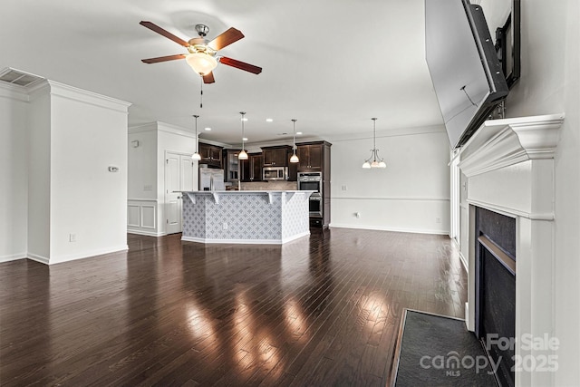 1617 Post Ct, Gastonia, NC 28054 - unfurnished living room featuring ornamental molding, ceiling fan, a fireplace, visible vents, and dark wood-type flooring