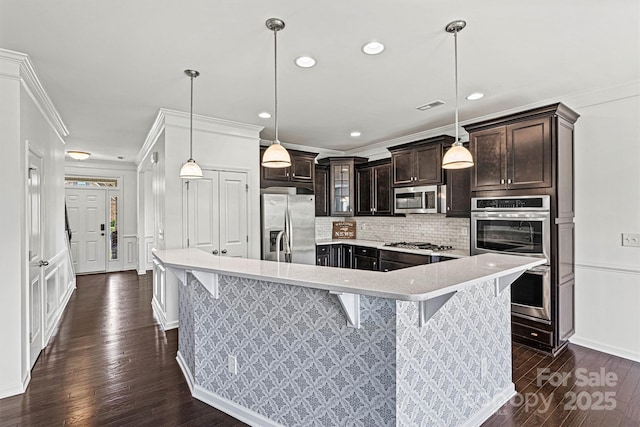 1617 Post Ct, Gastonia, NC 28054 - kitchen with stainless steel appliances, ornamental molding, dark wood finished floors, and backsplash