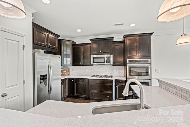 1617 Post Ct, Gastonia, NC 28054 - kitchen featuring backsplash, a sink, visible vents, stainless steel appliances, and hanging light fixtures