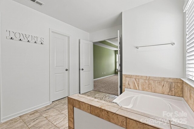1617 Post Ct, Gastonia, NC 28054 - full bath featuring a wealth of natural light, visible vents, a bath, and baseboards