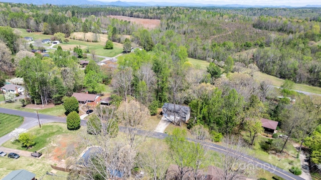 aerial view featuring a view of trees