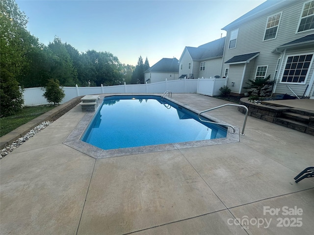 view of pool featuring a fenced in pool, a patio area, and a fenced backyard