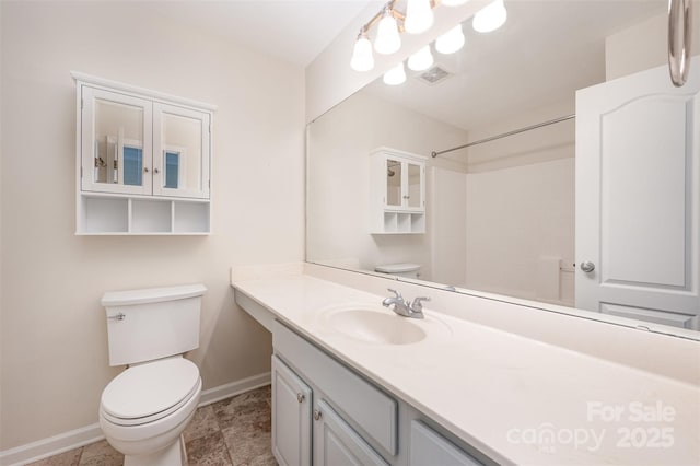 full bath with visible vents, toilet, vanity, and baseboards