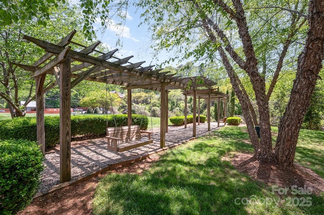 view of community with a pergola and a yard
