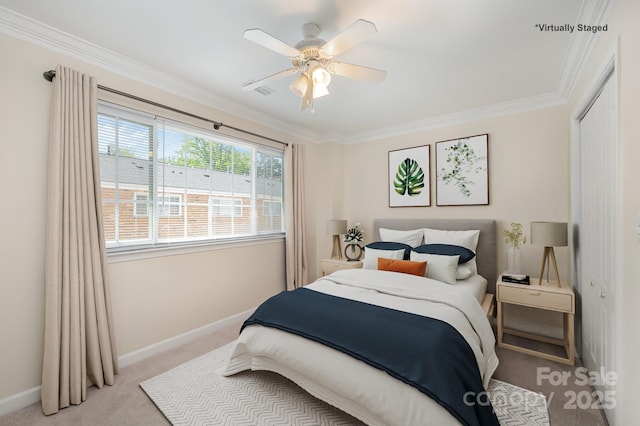 bedroom with baseboards, a closet, light colored carpet, and crown molding