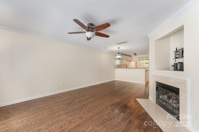 unfurnished living room with dark wood-style flooring, ornamental molding, visible vents, ceiling fan, and a high end fireplace