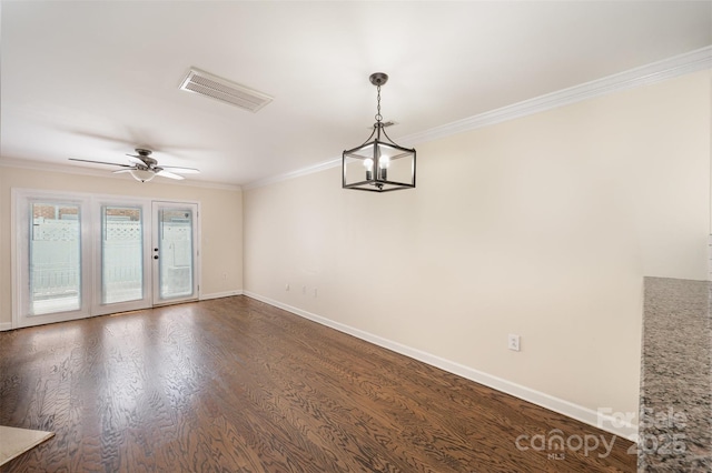 unfurnished room with a ceiling fan, ornamental molding, visible vents, wood finished floors, and baseboards