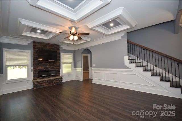 6519 Pargo Rd, Charlotte, NC 28216 - unfurnished living room featuring ornamental molding, wood finished floors, a fireplace, ceiling fan, and coffered ceiling