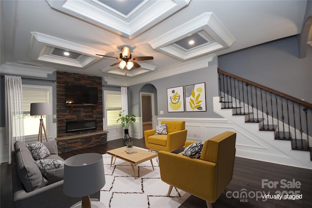 6519 Pargo Rd, Charlotte, NC 28216 - living area featuring crown molding, wood finished floors, arched walkways, a ceiling fan, and coffered ceiling