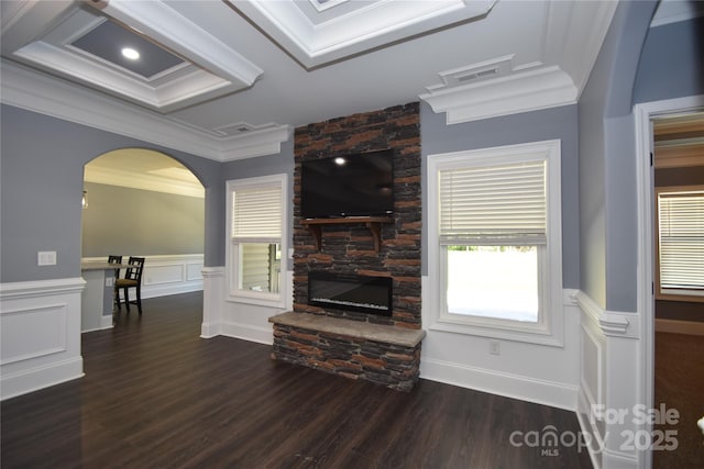 6519 Pargo Rd, Charlotte, NC 28216 - living area featuring crown molding, a fireplace, arched walkways, a wainscoted wall, and wood finished floors
