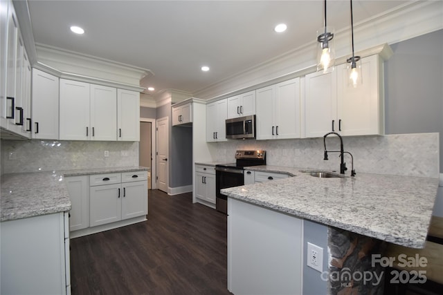 6519 Pargo Rd, Charlotte, NC 28216 - kitchen with crown molding, a peninsula, light stone countertops, a sink, and appliances with stainless steel finishes