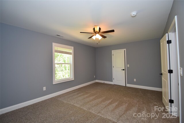 6519 Pargo Rd, Charlotte, NC 28216 - carpeted empty room with baseboards, ceiling fan, and visible vents