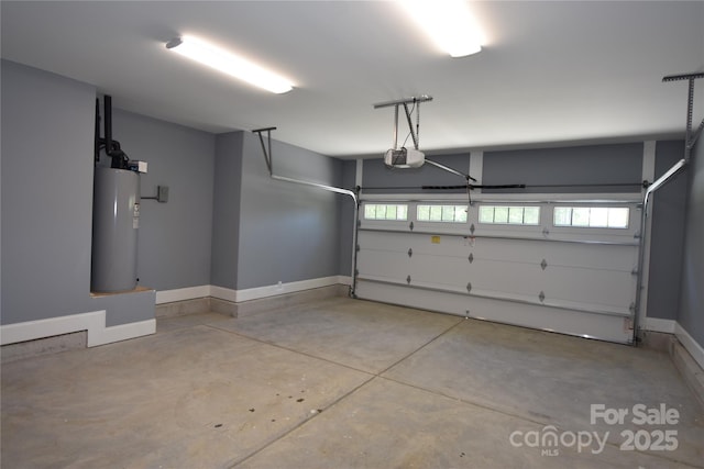 6519 Pargo Rd, Charlotte, NC 28216 - garage with baseboards, a garage door opener, and water heater