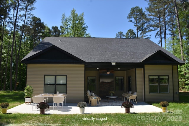 6519 Pargo Rd, Charlotte, NC 28216 - back of property with a lawn, a ceiling fan, a patio, and a shingled roof