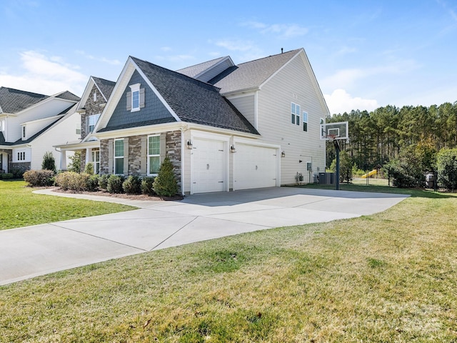 view of home's exterior featuring a lawn, stone siding, an attached garage, a shingled roof, and driveway