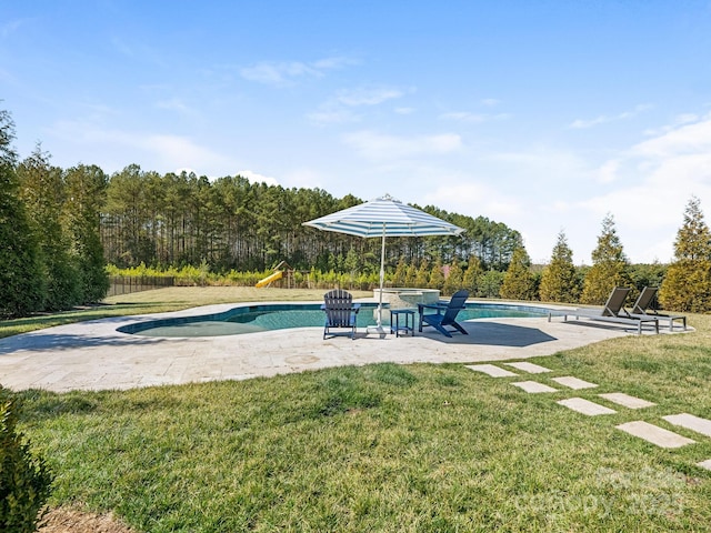 pool featuring a patio, playground community, fence, and a lawn