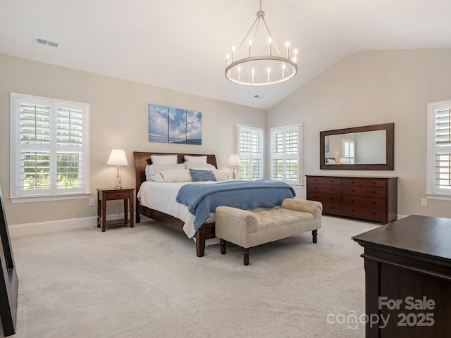 bedroom with light carpet, visible vents, vaulted ceiling, and an inviting chandelier