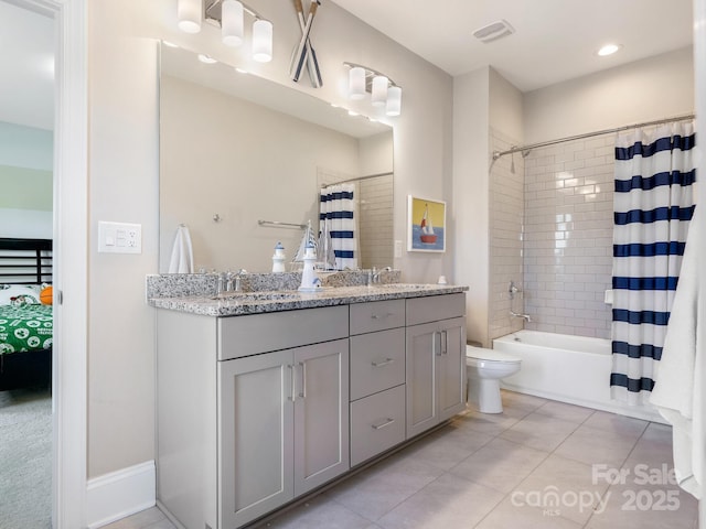 full bathroom with visible vents, a sink, shower / tub combo with curtain, double vanity, and tile patterned flooring