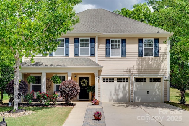 985 Angelica Ln, Tega Cay, SC 29708 - view of front facade featuring concrete driveway, an attached garage, a shingled roof, and a front lawn