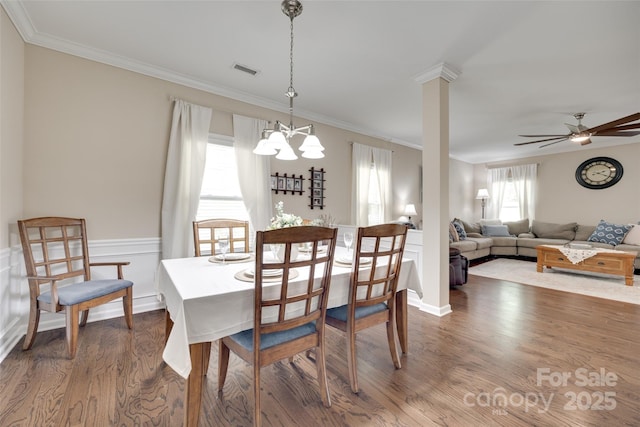 985 Angelica Ln, Tega Cay, SC 29708 - dining room with visible vents, ceiling fan with notable chandelier, crown molding, and wood finished floors