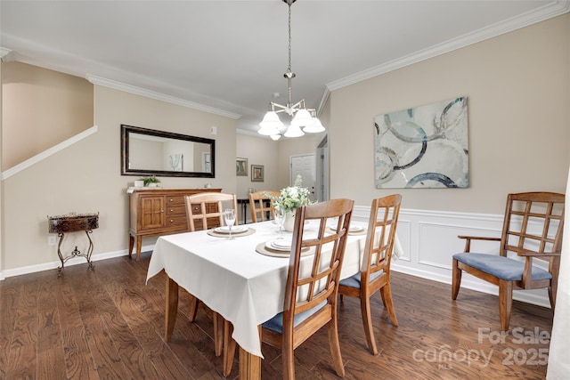 985 Angelica Ln, Tega Cay, SC 29708 - dining space with a wainscoted wall, ornamental molding, a chandelier, and dark wood-type flooring