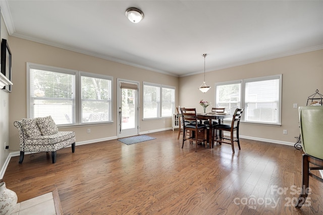 985 Angelica Ln, Tega Cay, SC 29708 - dining space featuring crown molding, baseboards, and wood finished floors