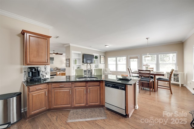 985 Angelica Ln, Tega Cay, SC 29708 - kitchen featuring crown molding, brown cabinets, a sink, light wood-style flooring, and dishwasher