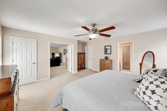 985 Angelica Ln, Tega Cay, SC 29708 - bedroom featuring baseboards, a ceiling fan, connected bathroom, and light colored carpet