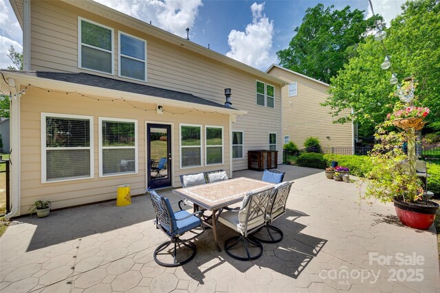985 Angelica Ln, Tega Cay, SC 29708 - back of house with a patio, outdoor dining area, and fence
