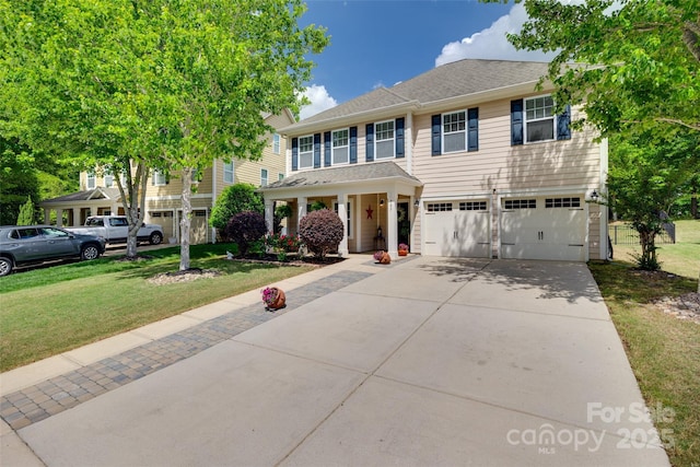 985 Angelica Ln, Tega Cay, SC 29708 - view of front of property with concrete driveway, covered porch, a front yard, and a garage